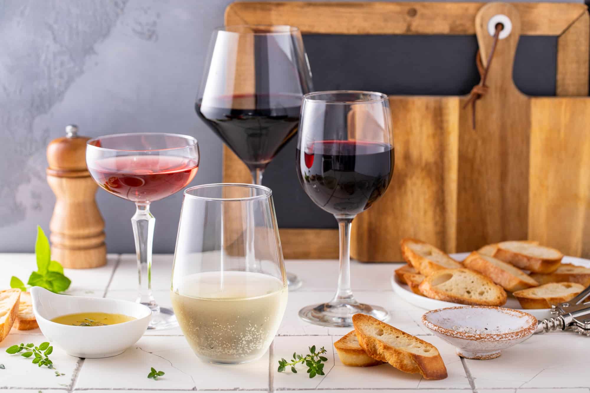 Variety of wine glasses with red, white and rose wine