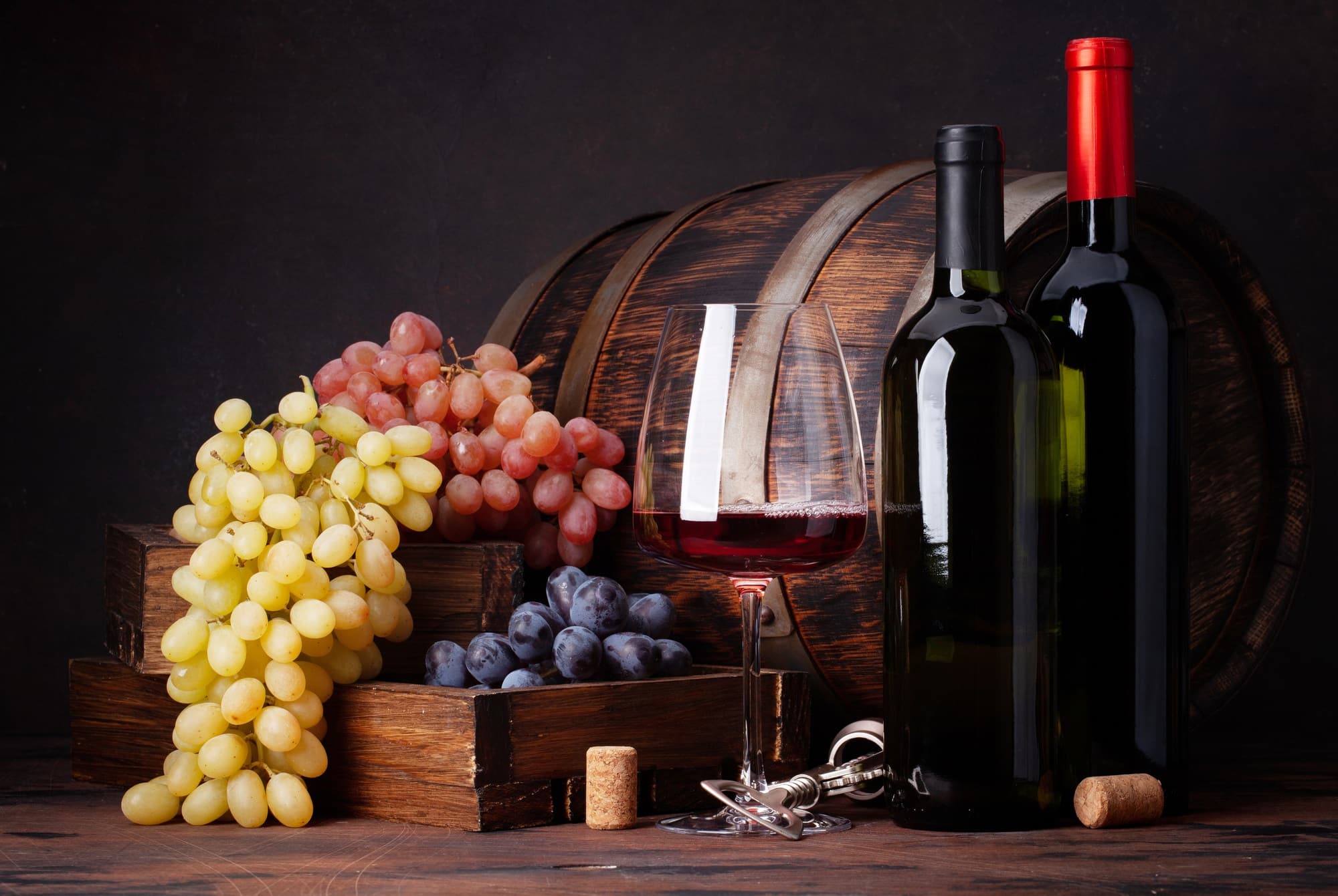 Wine bottles, grapes, glass of wine